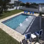 New-Smyrna-Beach-custom-pool-with-sun-shelf-and-paver-deck.jpg