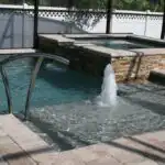 custompoolwithsunshelfandspa-1.jpg