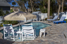 Plenty of room to relax poolside around this custom pool by All Aqua Pools