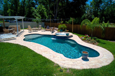 Free form pool with summer kitchen