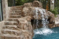 Close-up of faux rock stairs, grotto, and slide