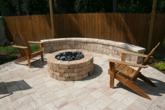 Propane gas fire pit and curved sitting wall