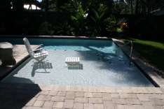 Super sized sun shelf in modern pool