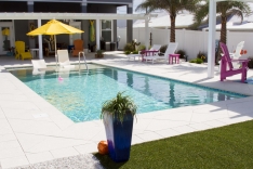 The large sun shelf at one end of the pool has room for an umbrella and two lounge chairs