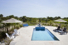Sand dunes are the backdrop for this modern pool