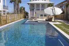 Modern pool with lap lane and blue granite pebble sheen interior finish