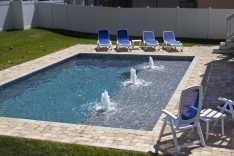 Modern pool with huge sun shelf and three bubblers