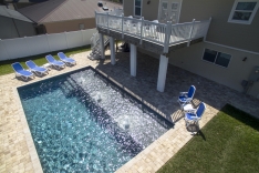 Modern pool with paver deck