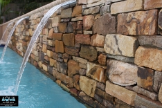 Rock wall in modern pool