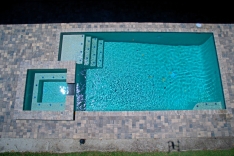 Modern pool with spa and sun shelf