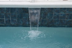Close-up of sheer waterfall in modern pool