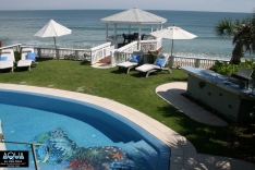 Oceanfront pool with bar and dock gazebo